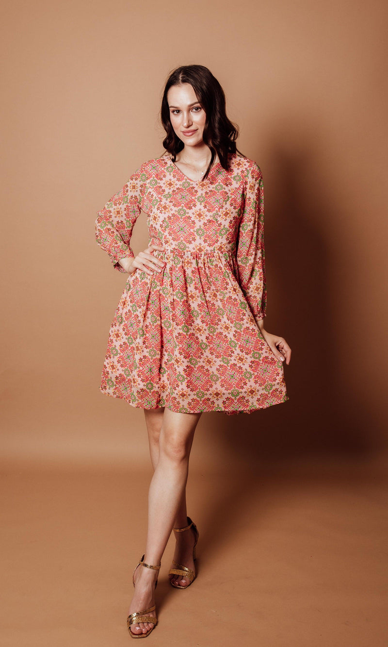 Floral Georgette V-Neck Mini Dress in coral, pink, and sage geometric print with long sleeves.