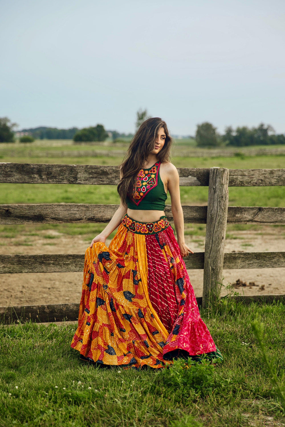 Full flare multicolor cotton Chaniya Choli set with green embroidered top, perfect for Garba styles.