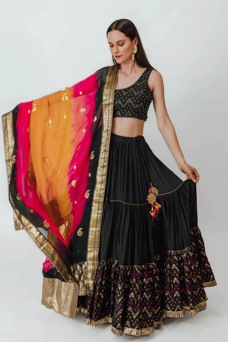 Close-up of hand-embroidered stones and cutdana on one-shoulder blouse