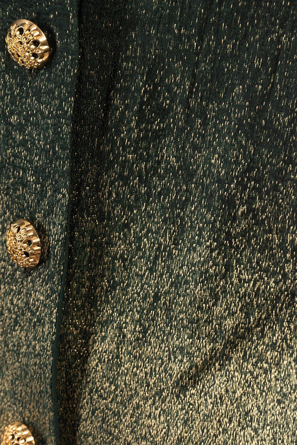 Green jacquard silk blazer dress with gold buttons and a green-to-golden fabric transition.