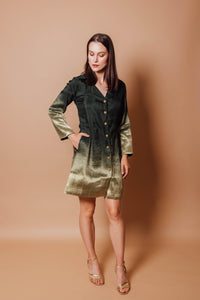 Green jacquard silk blazer dress with golden transition at hem and sleeves, featuring a tailored fit and front closure.
