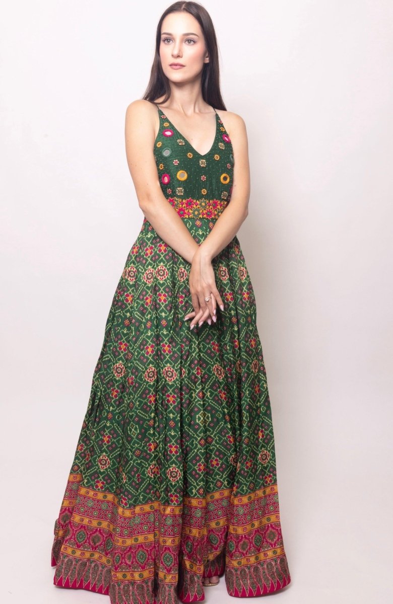 Green silk open-back gown with hand-embroidered halter torso and patola patterns.