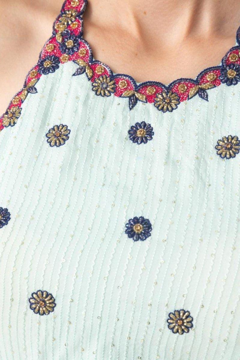 Close-up of the Amelia High Low Aqua Dress, showcasing intricate hand embroidery on the georgette fabric.
