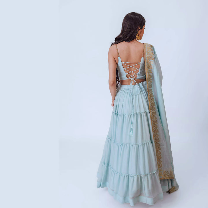 Elvia Sky Blue Shimmer Tiered Lehenga choli with Gold Accents