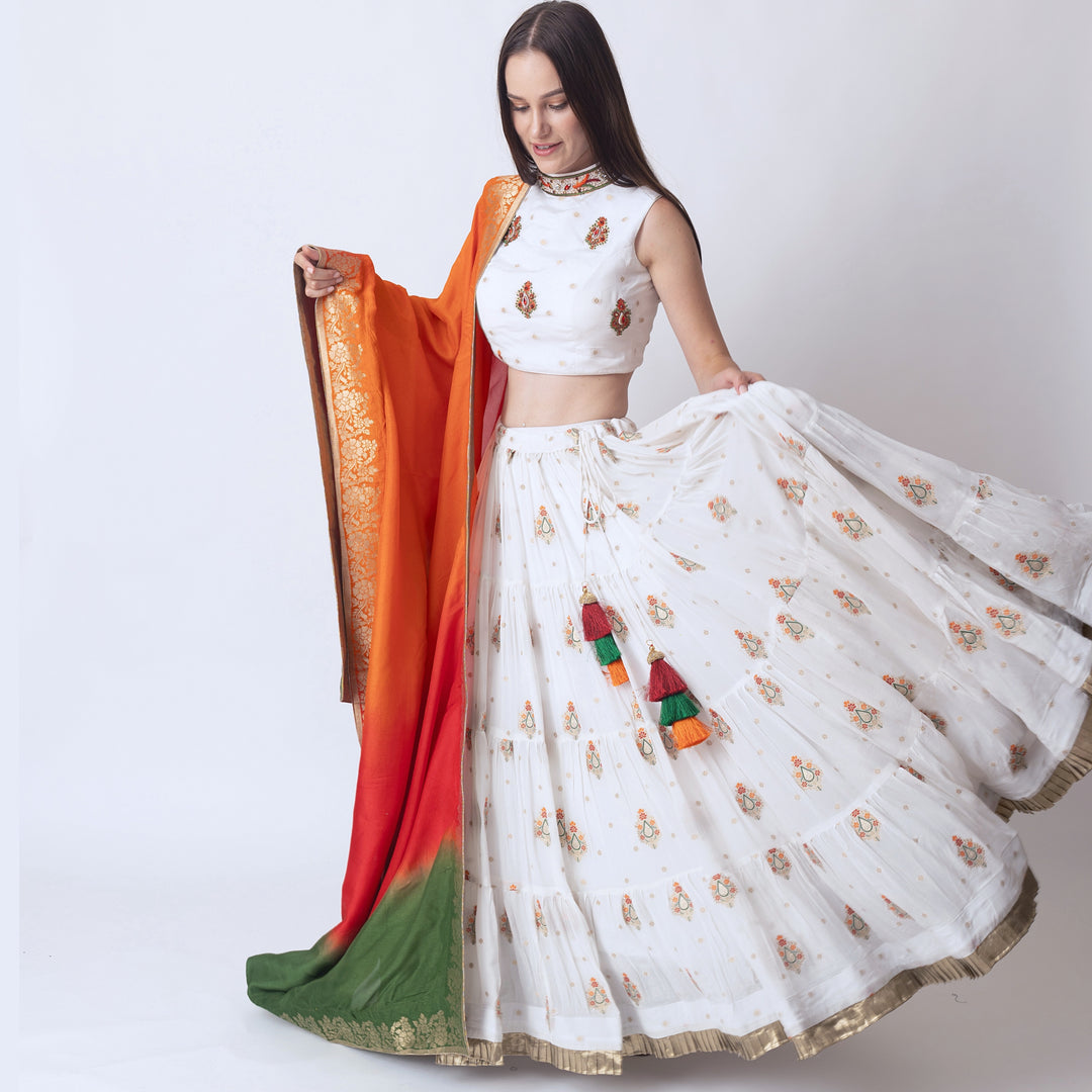 Rose White lehenga with embroidered high neck choli and multi color dupatta