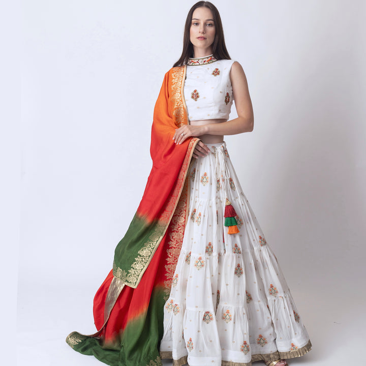 Rose White lehenga with embroidered high neck choli and multi color dupatta