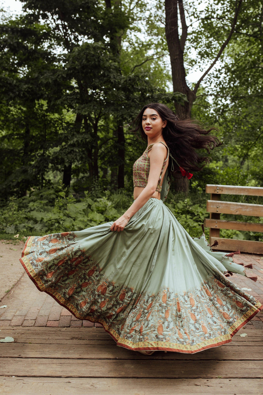 Back view of pista green lehenga with embroidered blouse