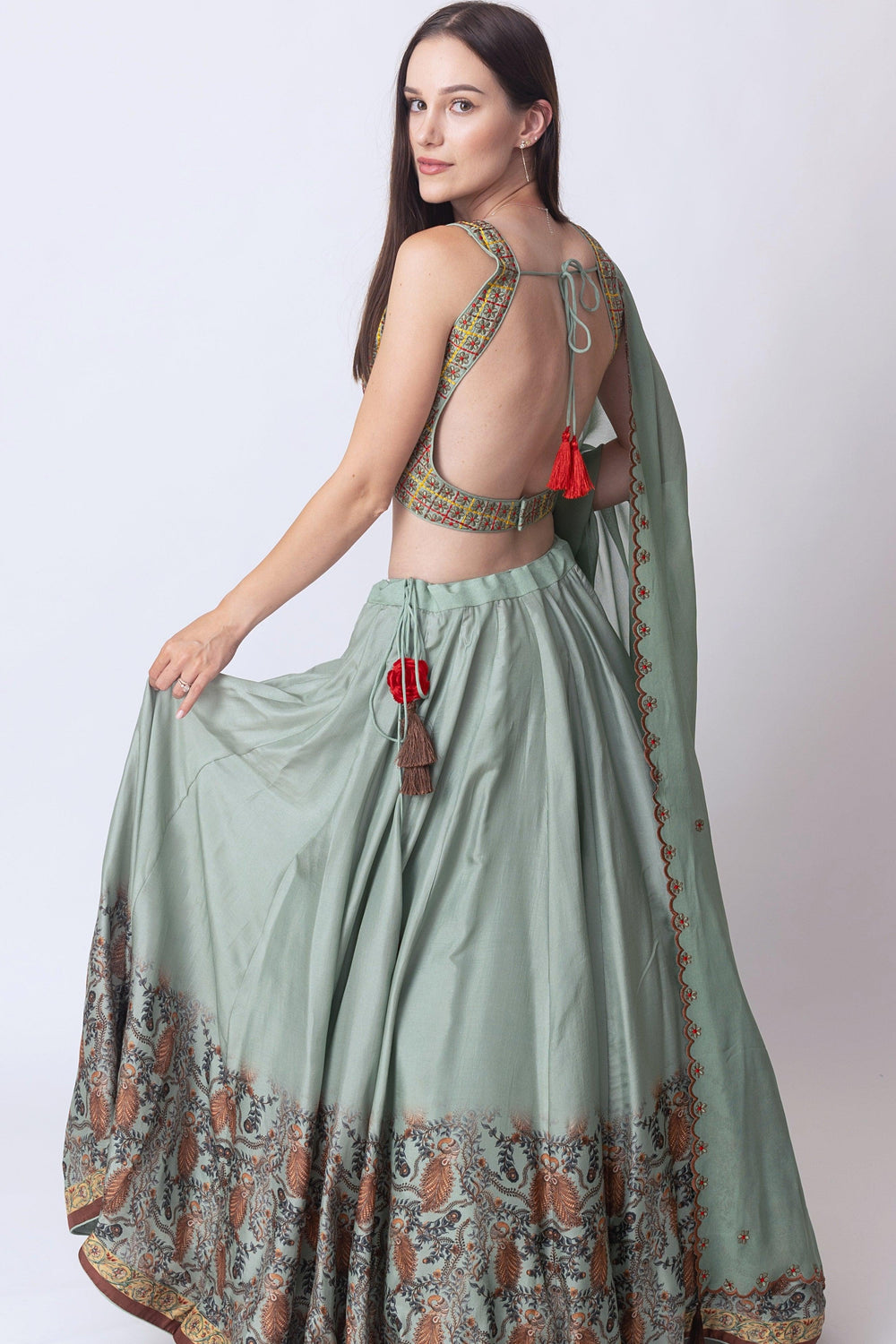 Full view of pista green lehenga with 8-meter flare and dupatta