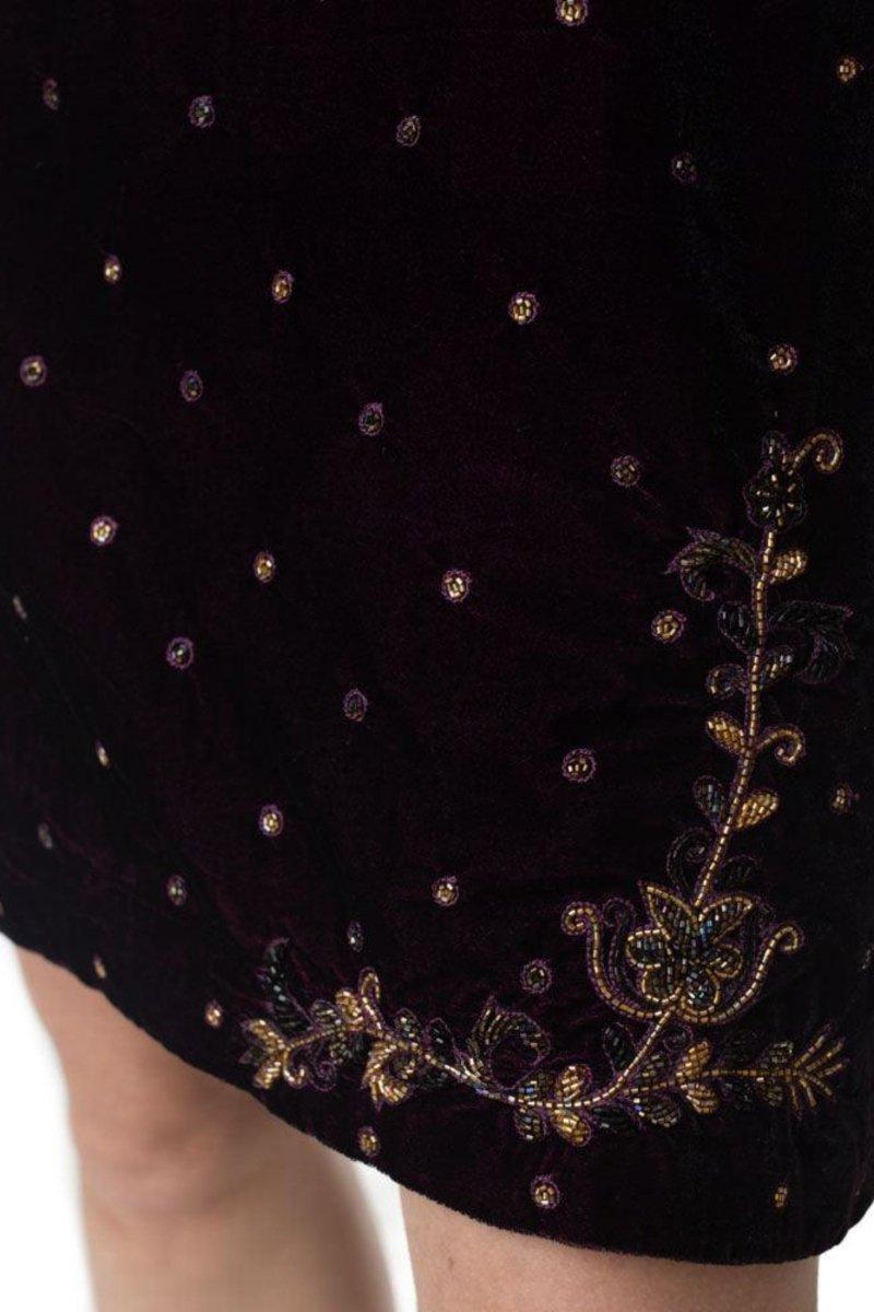 Close-up of Lica Wine Velvet Dress, showcasing intricate gold and purple hand embroidery on rich velvet fabric.