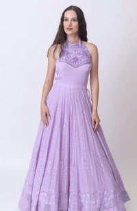 Lilac silk high-neck gown with heavily embroidered torso and all-over chikankari skirt.