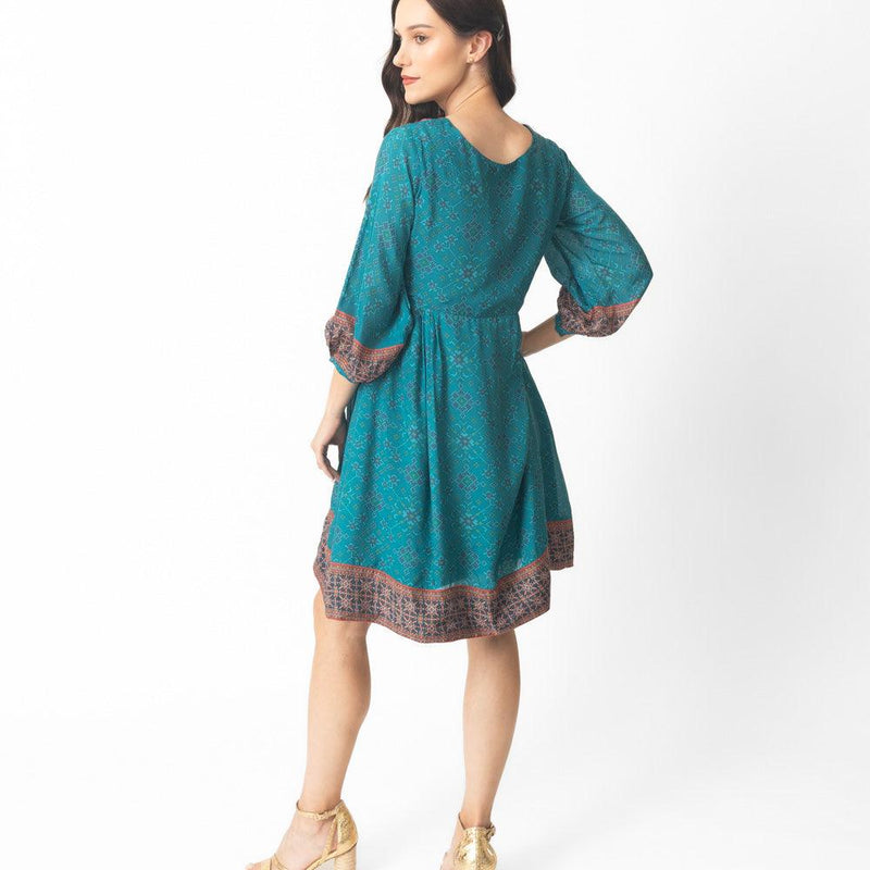 Livia Aqua Short Silk Dress with Patola Print, 3/4 sleeves, V-neck, and contrasting border.