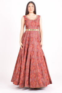 Maroon silk bandhani gown with a golden mirror belt, full-length and sleeveless.
