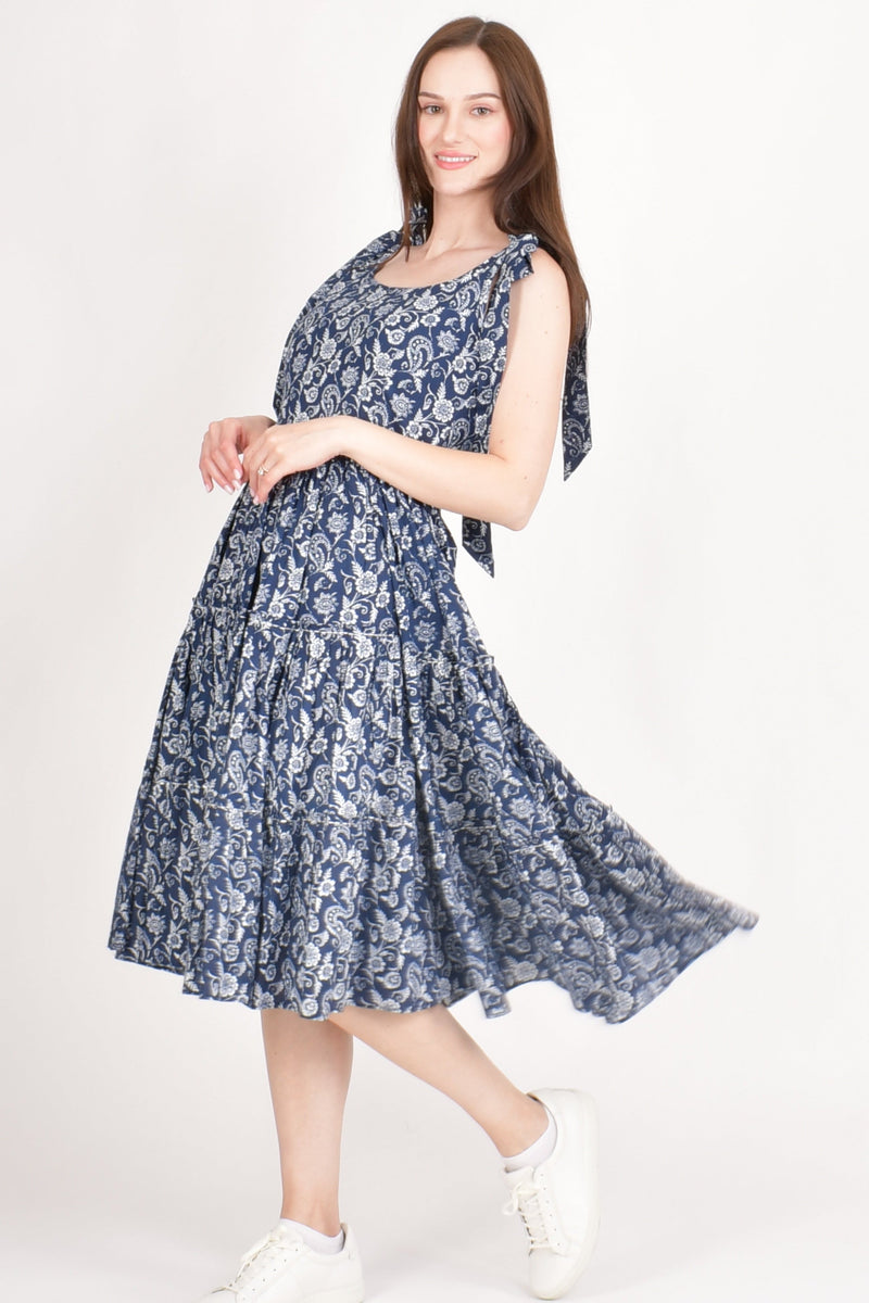 Mila Blue Tiered Midi Dress: floral print cotton, fit-and-flare, bow-tie shoulder straps.