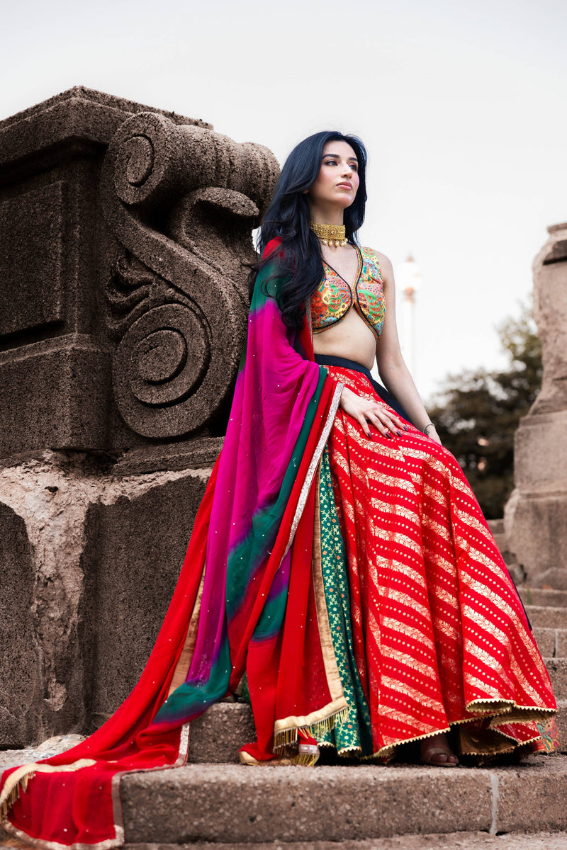 Multi-color full flare Chaniya Choli set with embroidered blouse, red striped lehenga, and tie-dyed dupatta.