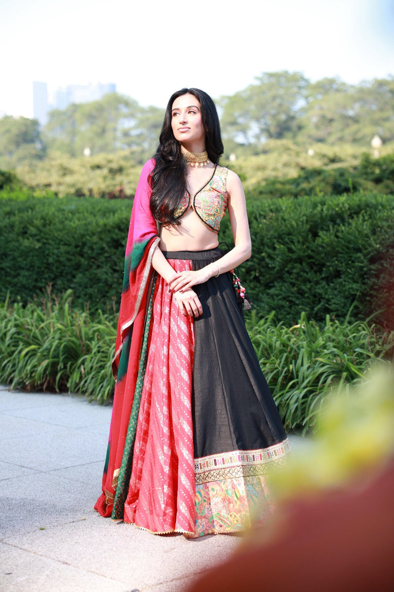 Multi-color full flare Chaniya Choli set with black lehenga, embroidered blouse, and tie-dyed dupatta.