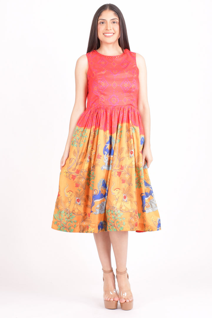 Woman wearing a dress with a red top and yellow floral skirt on a white background