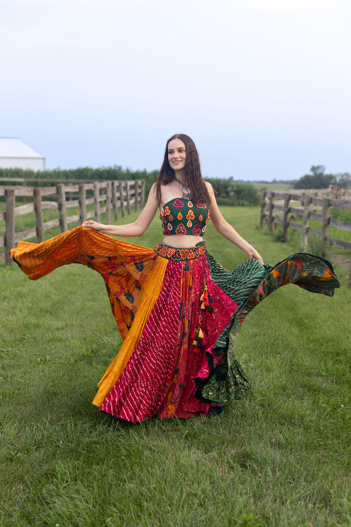 Woman in a multi-color cotton-silk chaniya choli set with a dramatic flare, perfect for Garba.