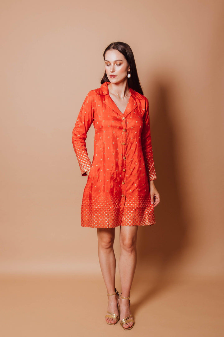 front photo of a model wearing orange blazer dress