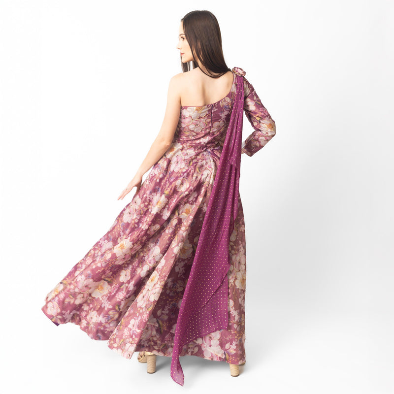 Wine organza one-shoulder gown with all-over floral embroidery and a flowing silhouette.