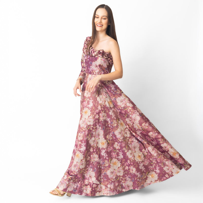 Pink floral organza one-shoulder gown with 3D flowers on the neckline, flowing skirt.