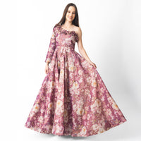 Pink floral organza one-shoulder gown with 3D flowers along the neckline.