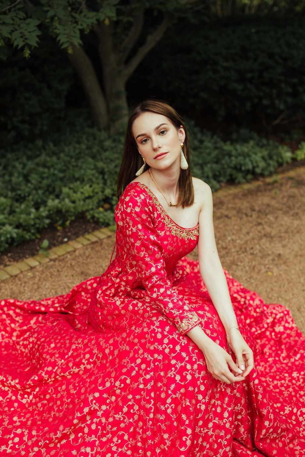 Elegant Akari pink one-shoulder silk brocade gown with intricate patterns and hand-embroidered neckline.