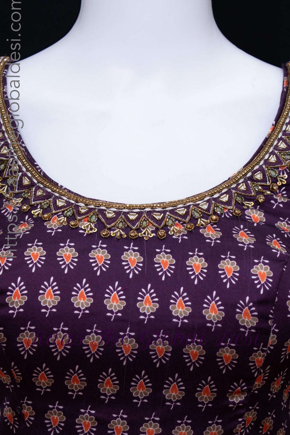 Purple silk dress with intricate zardoshi, stone, and resham embroidery on the neckline and a subtle print.