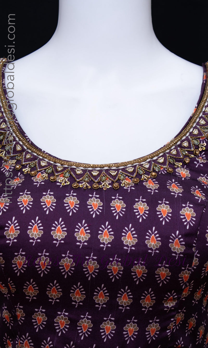 Purple silk dress with intricate zardoshi, stone, and resham embroidery on the neckline and a subtle print.