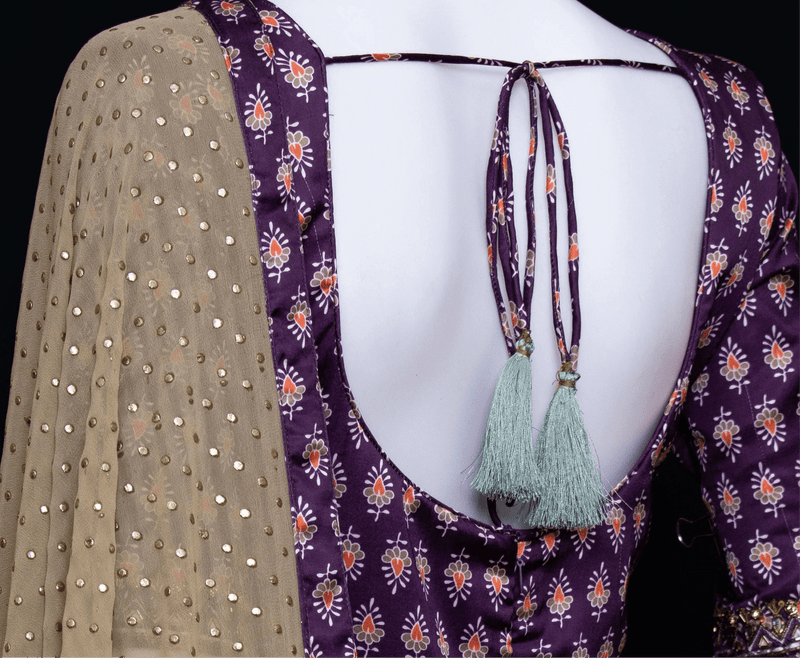 Back of purple silk dress with floral print, half sleeves, and georgette drape with sequins.