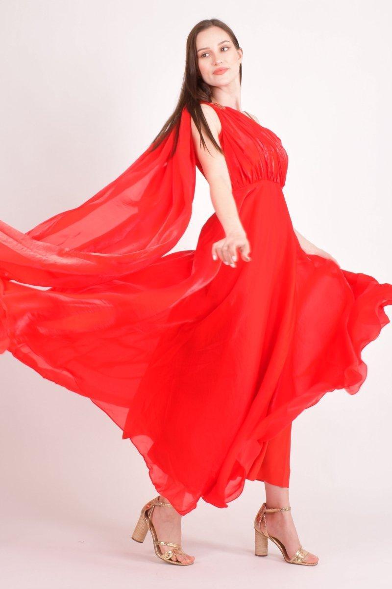 Red silk one-shoulder maxi dress with rhinestone-embellished strap and flowing skirt.