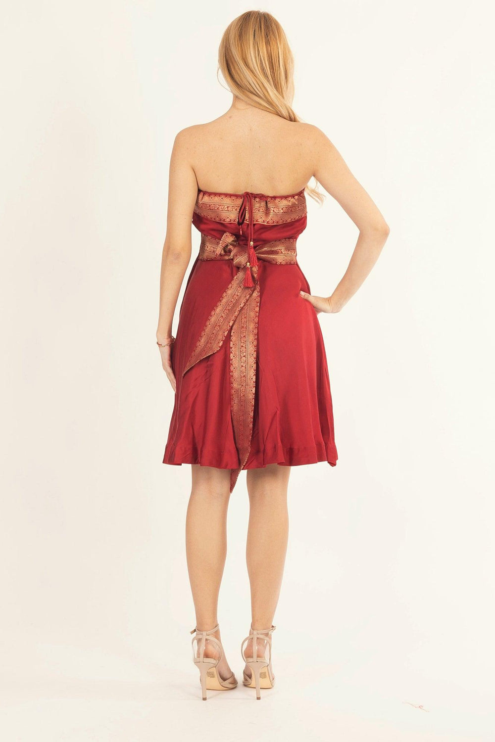 Red silk strapless mini dress with jacquard weaving at the border and a back zipper closure.