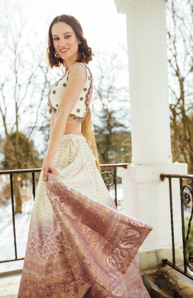 Back view of shaded Banarasi silk lehenga choli with hand-embroidered blouse