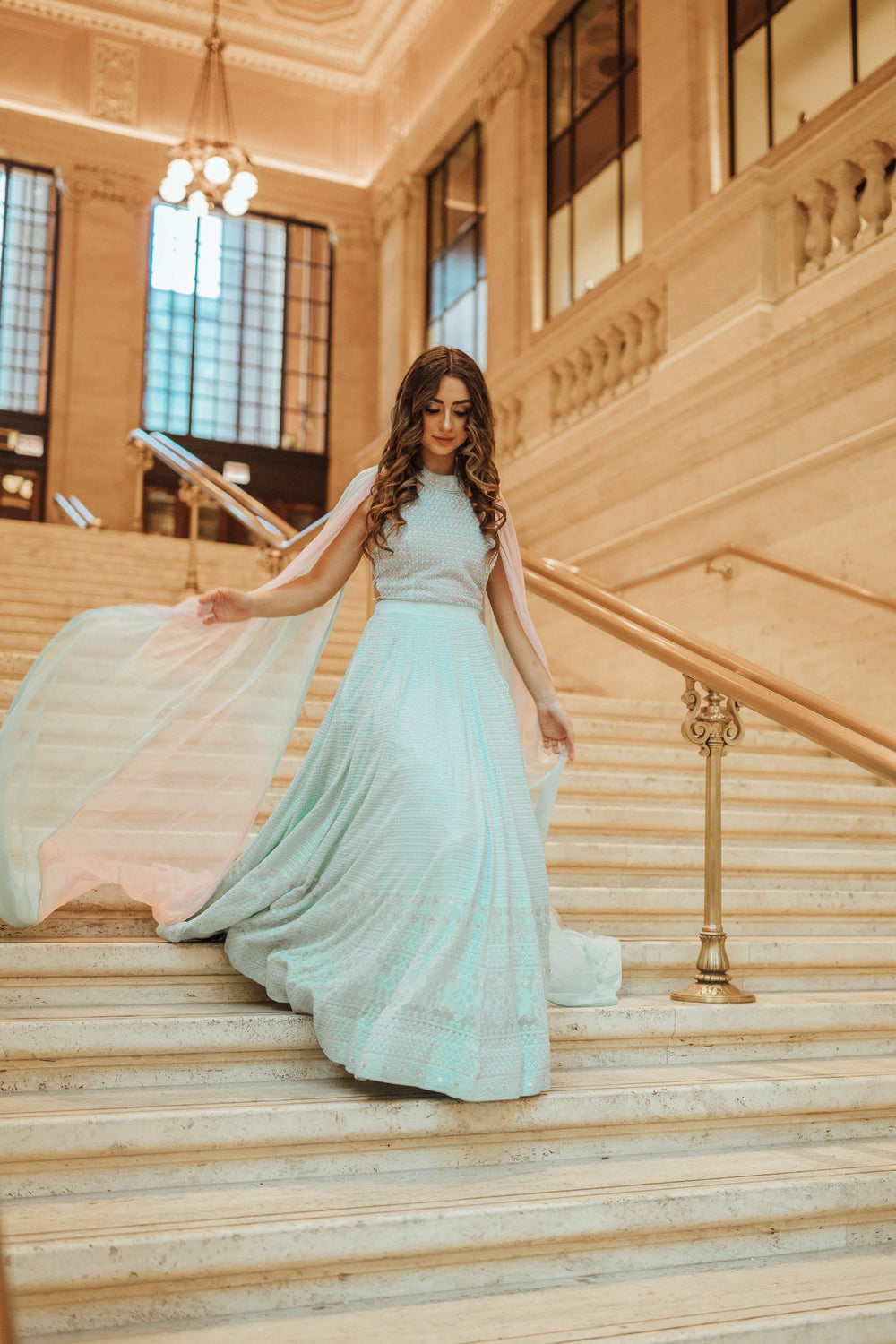 Sky blue georgette gown with chikankari, sequin, cutdana, and stonework embroidery, featuring a tie-dyed chiffon drape.