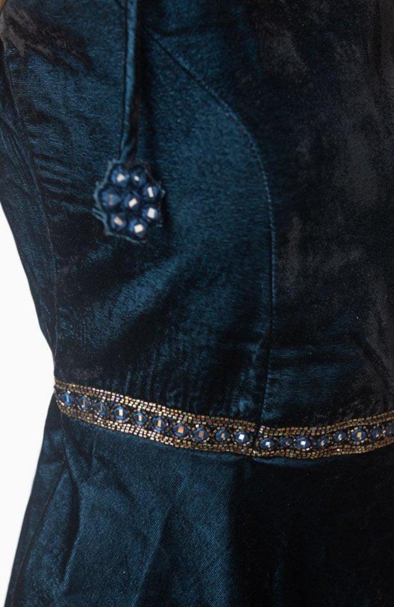 Teal velvet short dress with hand-embroidered waistband and string tie shoulder detail.