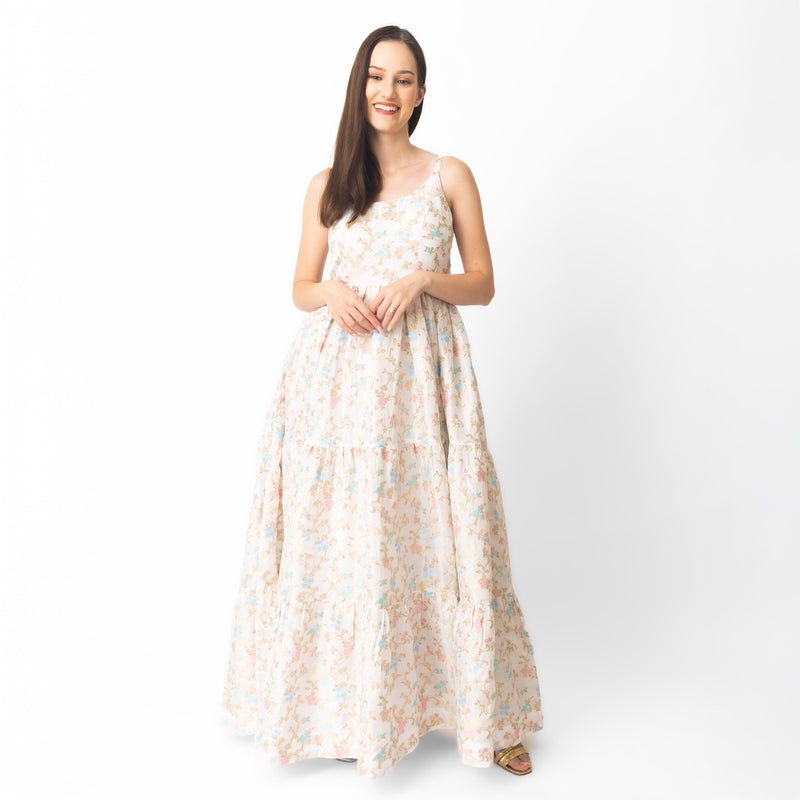 Tiered floral maxi dress with delicate jacquard weaving, scoop neck, and graceful flow.