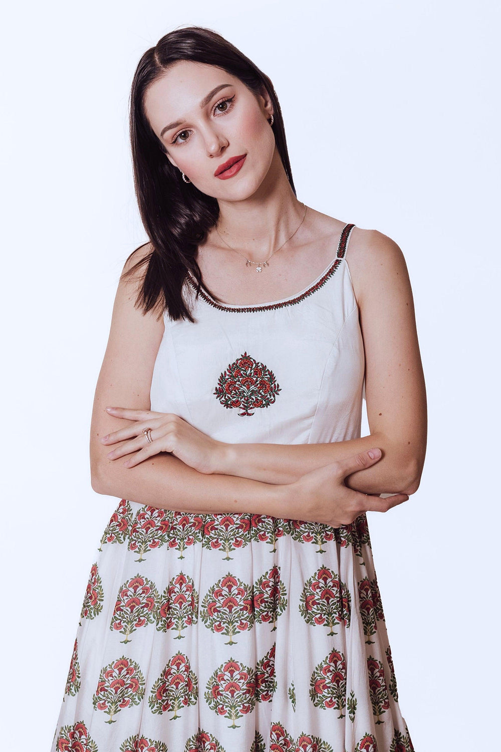 White Ajrakh print silk gown with embroidered neckline and floral printed skirt.