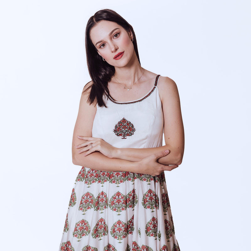 White Ajrakh print silk gown with embroidered neckline and floral printed skirt.