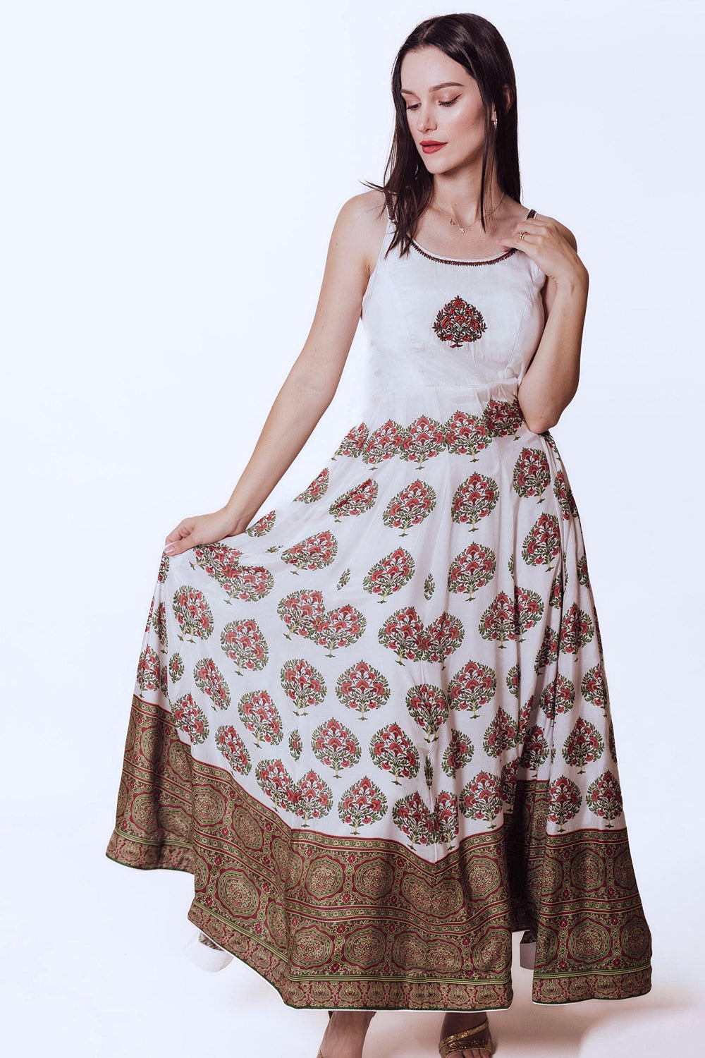 Elegant off-white silk gown with embroidered neckline, printed skirt, and ajrakh print hem.