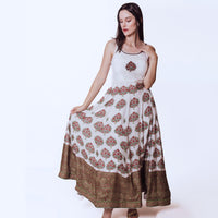 Elegant off-white silk gown with embroidered neckline, printed skirt, and ajrakh print hem.
