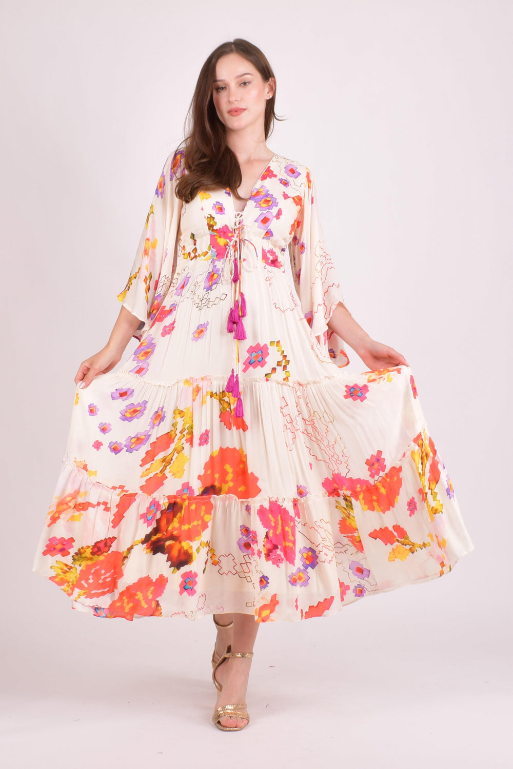 White floral ruffle maxi dress with angel sleeves and colorful watercolor prints.