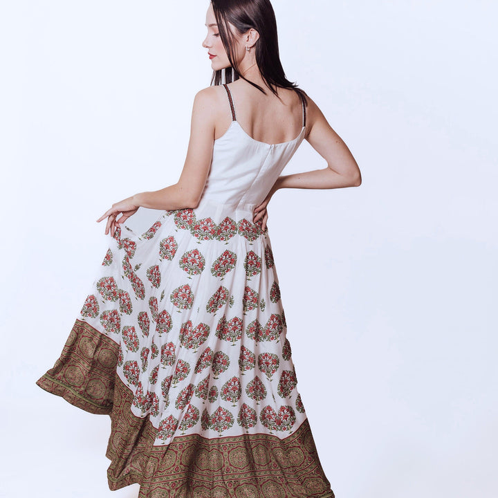 back photo of a model wearing raas white gown