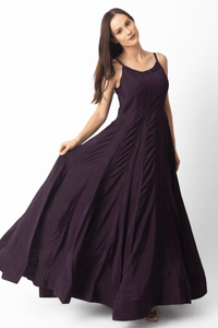 Model wearing a wine A-line velvet gown with a hand-embroidered neckline and voluminous skirt.