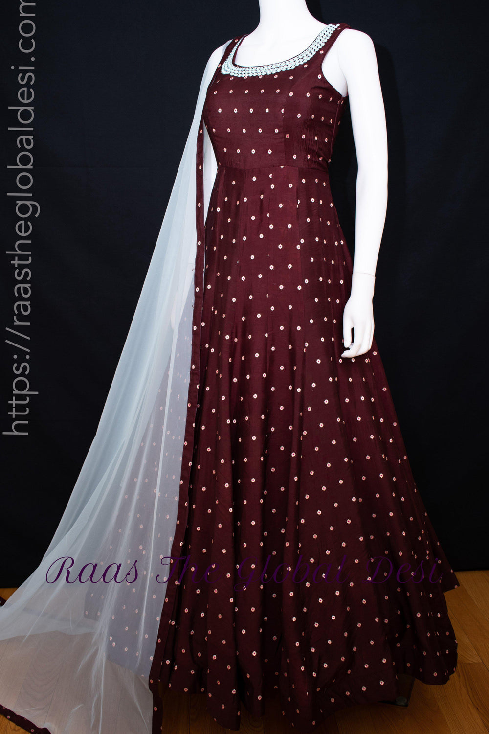 Wine silk long dress with a-line silhouette, resham and mirror embroidery, and a light net drape.