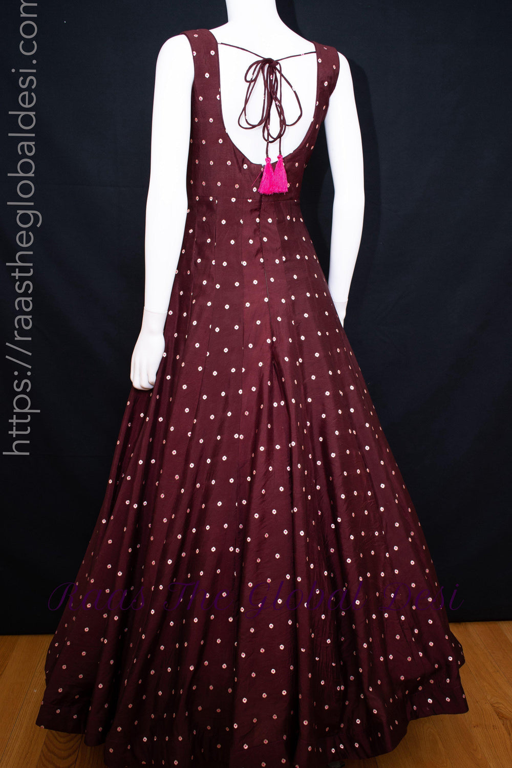 Wine silk a-line gown with resham and mirror embroidery, sleeveless, back zipper, and string tie.