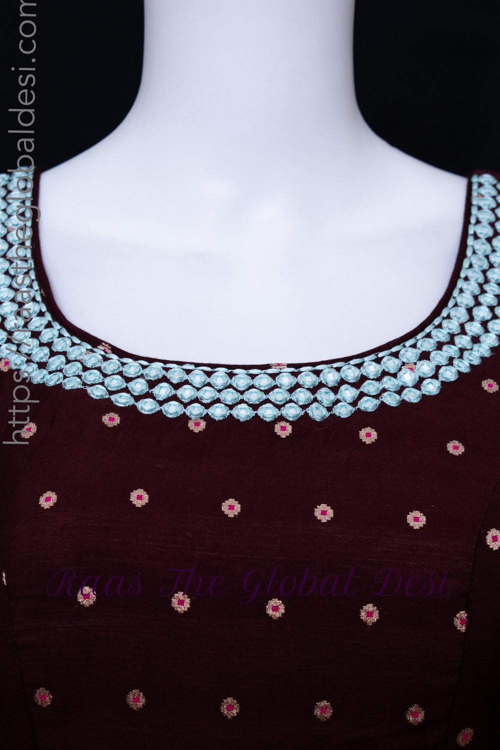 Wine silk gown with intricate resham and mirror embroidery on the neckline and bodice.