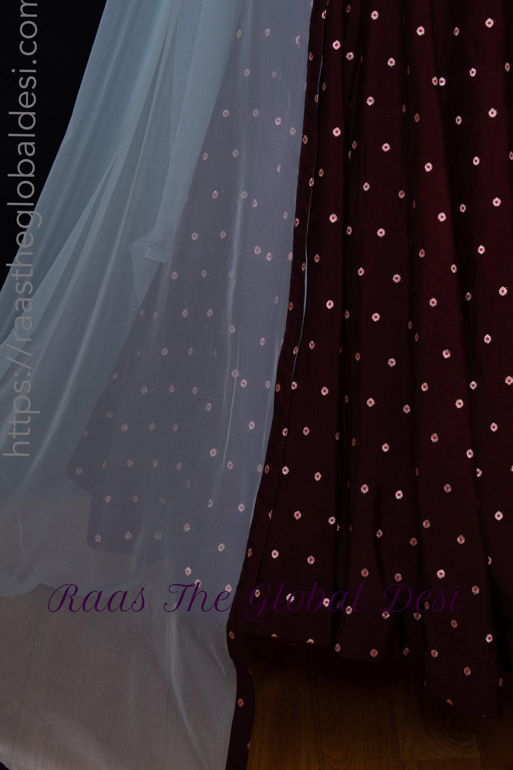 Wine silk a-line gown with resham and mirror embroidery, paired with a sheer net drape.