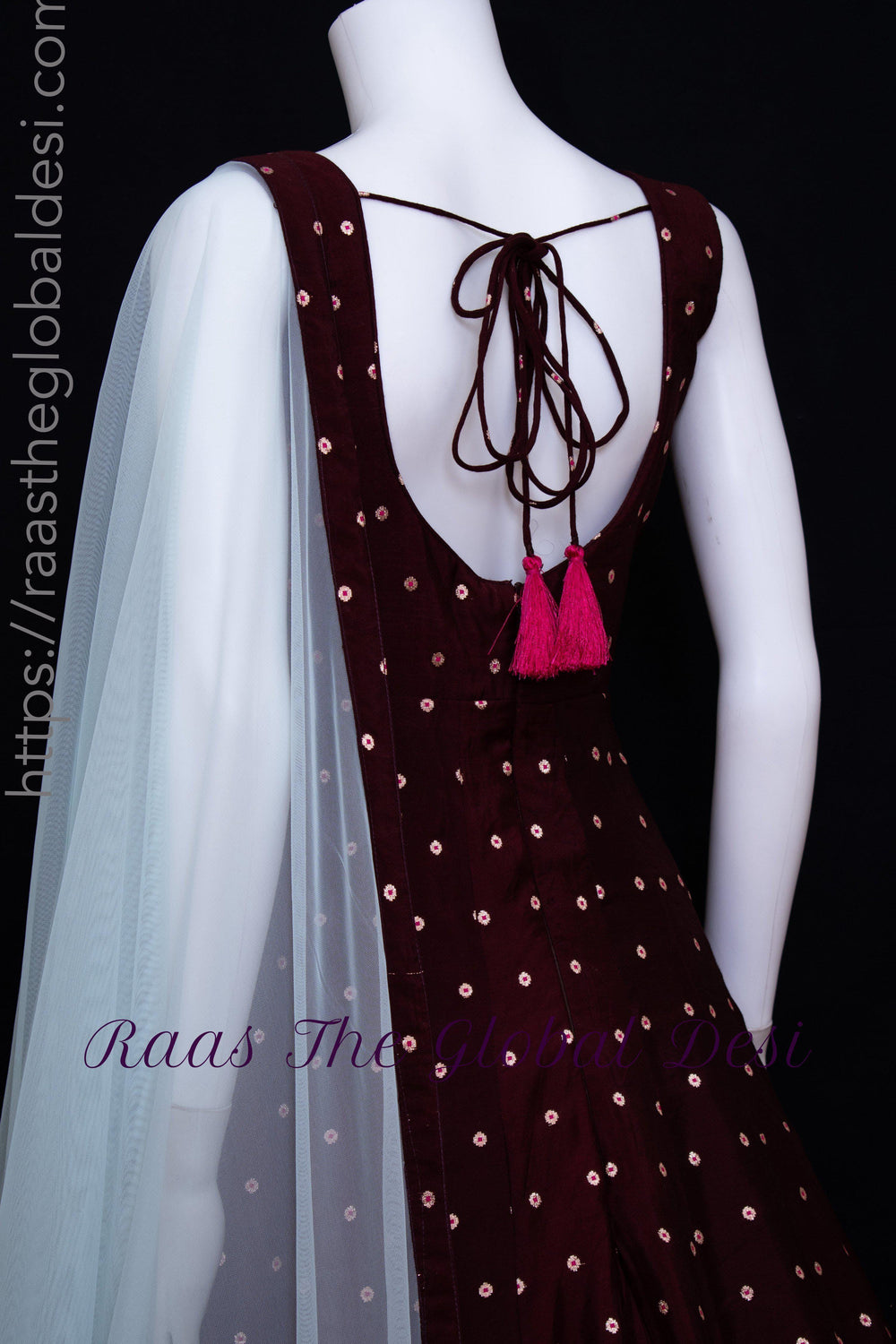 Wine silk gown with resham and mirror embroidery, back string tie, and light net drape.