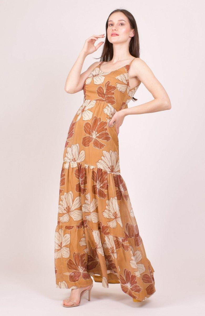 Yellow organza tiered maxi dress with rust and cream oversized floral print, spaghetti straps, and side pockets.