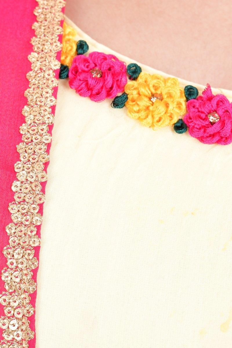 Close-up of a yellow ombre silk maxi sundress with a hand-embroidered neckline featuring pink and yellow floral resham and stone work.