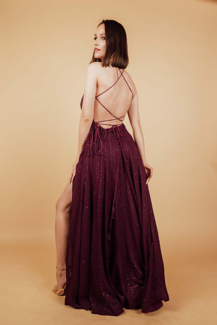 Back photo of model wearing maroon gown by raas